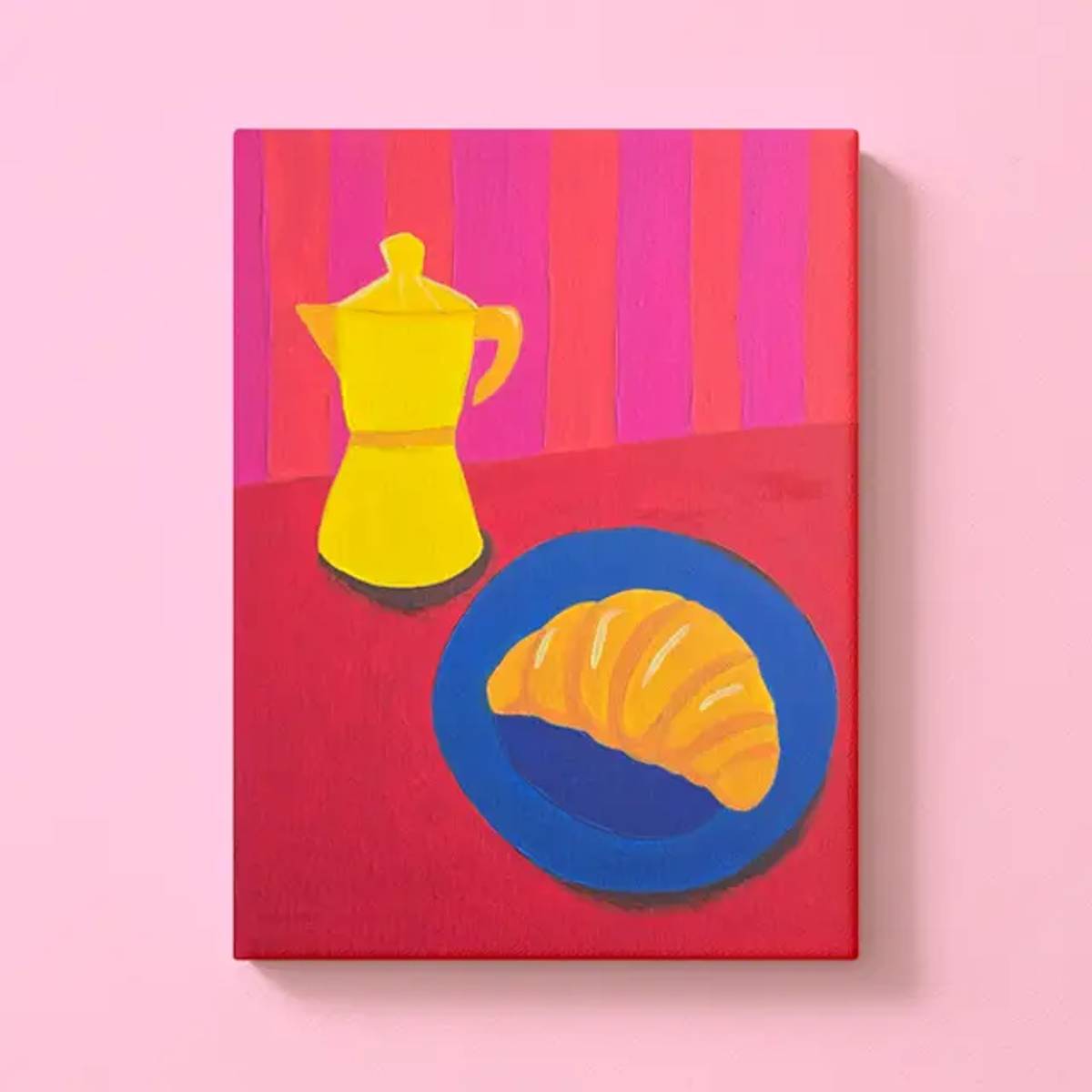 Eine Leinwand, auf der ein Croissant und eine Kaffeemaschine in fröhlichen Farben abgebildet sind