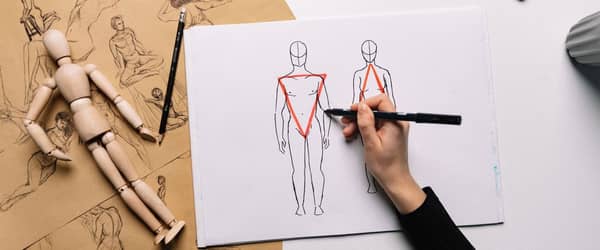 Die Proportionen eines Menschen werden auf einem Blatt Papier vorgeführt